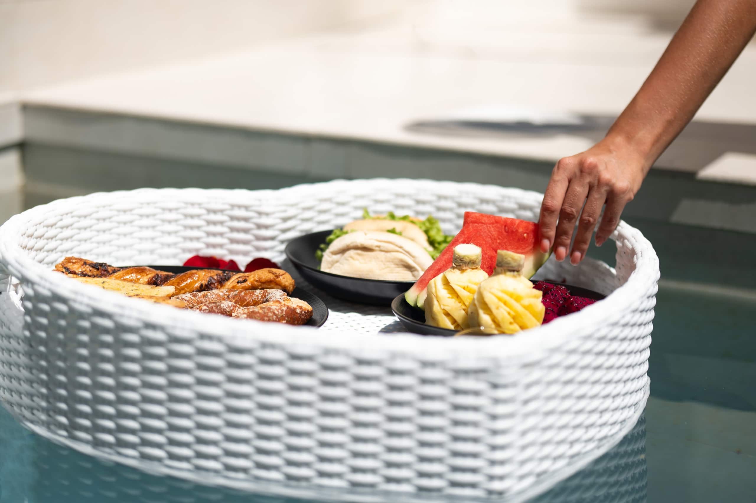 Floating breakfast in the pool of a villa